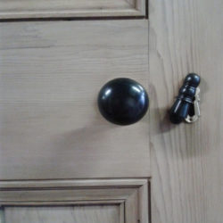 closeup image of door including handle that's been paint stripped
